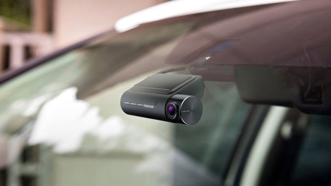 Dash camera installed neatly beside a car’s rearview mirror