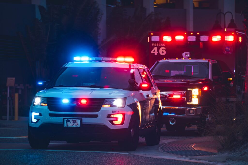 Police and emergency vehicles with warning lights